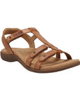 Brown strappy sandal with metal detail circles and contrast stitching with a floral footbed.