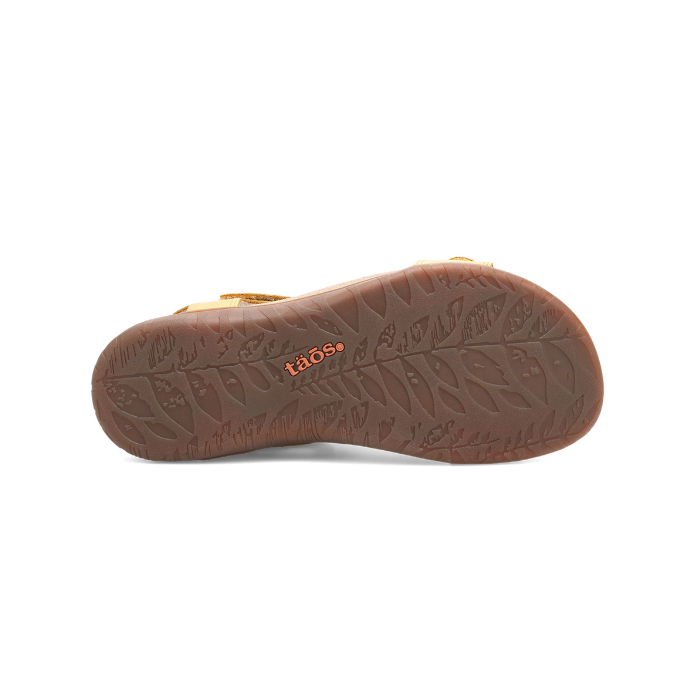 Leaf printed tread patter on brown outsole with orange Taos logo stamped in middle.