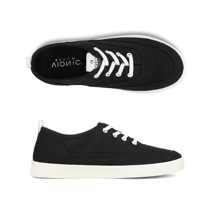 Pair of black casual sneakers with white elastic laces, black Vionic logo'd footbed and white outsole. 