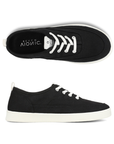 Pair of black casual sneakers with white elastic laces, black Vionic logo'd footbed and white outsole. 