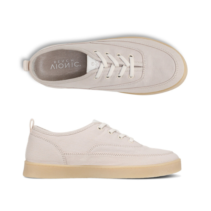 Pair of Light greyish pink casual sneaker with off-white laces, Vionic Logo'd footbed and tan outsole. 