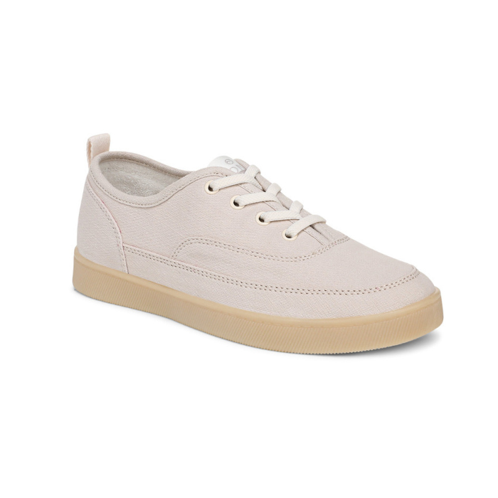 Light greyish pink casual sneaker with off-white laces and tan outsole. 