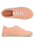 Pair of Peach casual sneakers with off-white laces, Vionic logo'd footbed and tan outsole. 