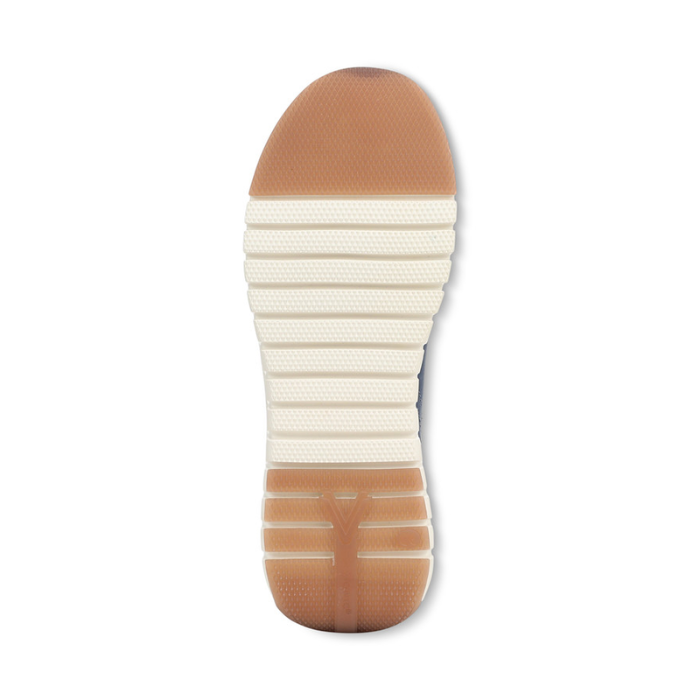 White light treaded outsole with brown section at toe and heel.