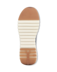 White light treaded outsole with brown section at toe and heel.