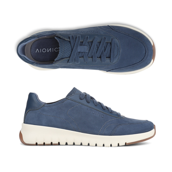 Pair of blue casual sneakers with accent stitching, Vionic logo on blue footbed, white midsole and tan outsole.