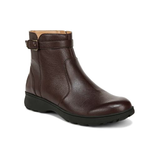 A brown ankle boot with a zipper, side buckle detail and a black outsole.