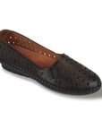 Black ballet flat shoe with oval cutouts, shell pattern imprints and brown outsole.