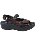 Geometric rainbow platform sandal with a closed side, open back, open toe, and adjustable hook-and-loop straps across the top and around the ankle.