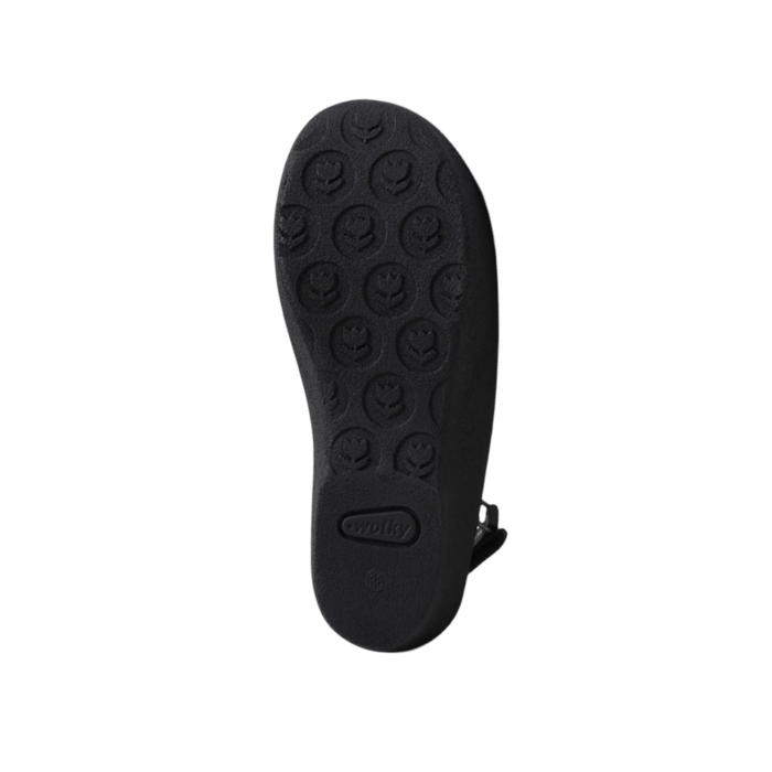 Black light treaded outsole with flower pattern tread and Wolky logo in heel.