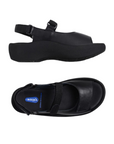 Pair of Black platform sandals with a closed side, open back, open toe, and adjustable hook-and-loop straps across the top and around the ankle.