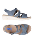 Pair of Blue backstrap sandals with two Velcro split design straps, tan Wolky logo'd footbed and cushioned grey outsole.