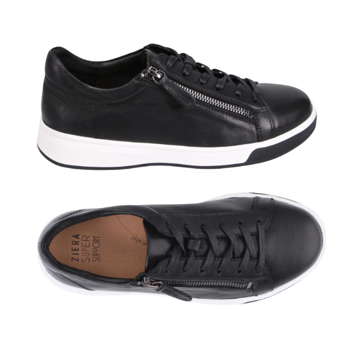 Pair of black leather low-top sneakers with a side zipper, black laces, tan Ziera logo'd footbed and a thick white midsole and black outsole.