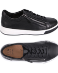 Pair of black leather low-top sneakers with a side zipper, black laces, tan Ziera logo'd footbed and a thick white midsole and black outsole.