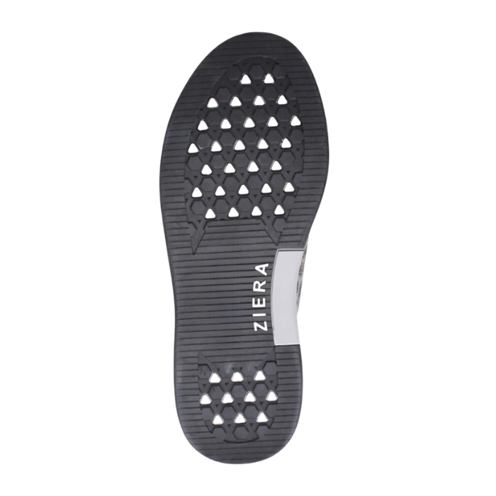 The black rubber outsole of a shoe with a textured tread pattern in triangular cutouts and the brand name 'ZIERA' printed vertically in white. 