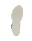 White light treaded outsole with L'Artiste logo stamped in middle.