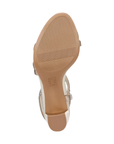 Tan light treaded outsole with block heel and Naturalizer logo in middle.