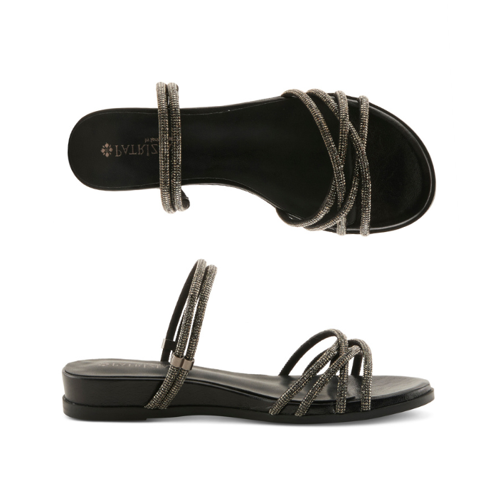 Pair of Black sparkly slide sandal with multiple criss-crossing straps, black Patrizia logo'd footbed and low wedge outsole.