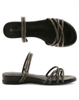 Pair of Black sparkly slide sandal with multiple criss-crossing straps, black Patrizia logo'd footbed and low wedge outsole.