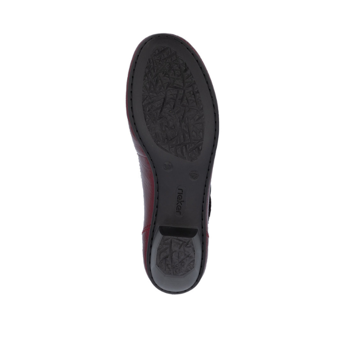 Black shoe outsole with &#39;Rieker&#39; logo stamped near heel