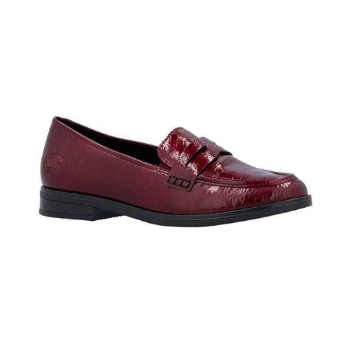 A red patent loafer with black rubber outsole.