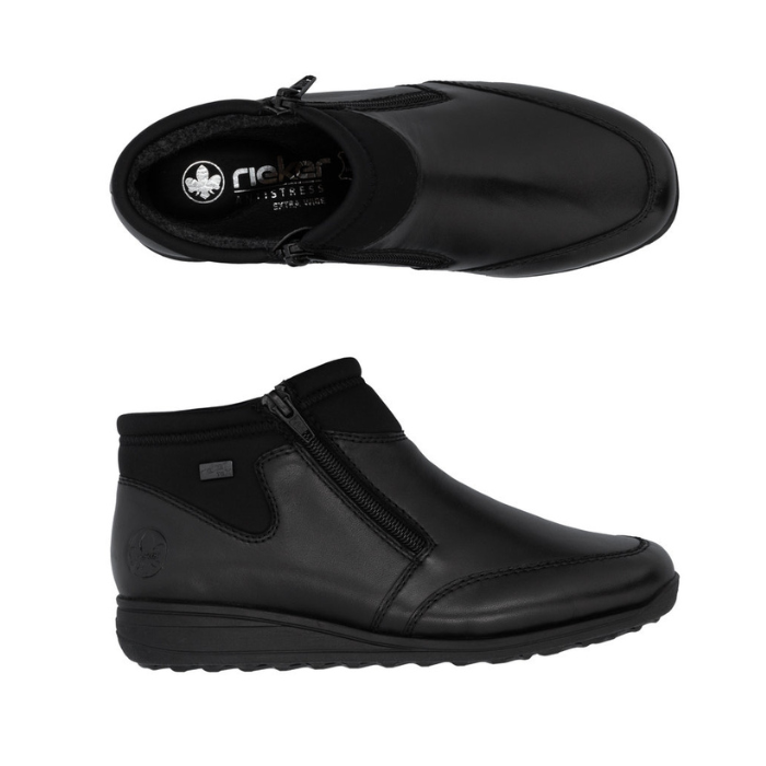 Pair of black ankle boots with side zippers and elastic cuff.