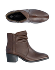 Pair of brown leather ankle boots with a ruched shaft, detailed stitching and a low black block heel.
