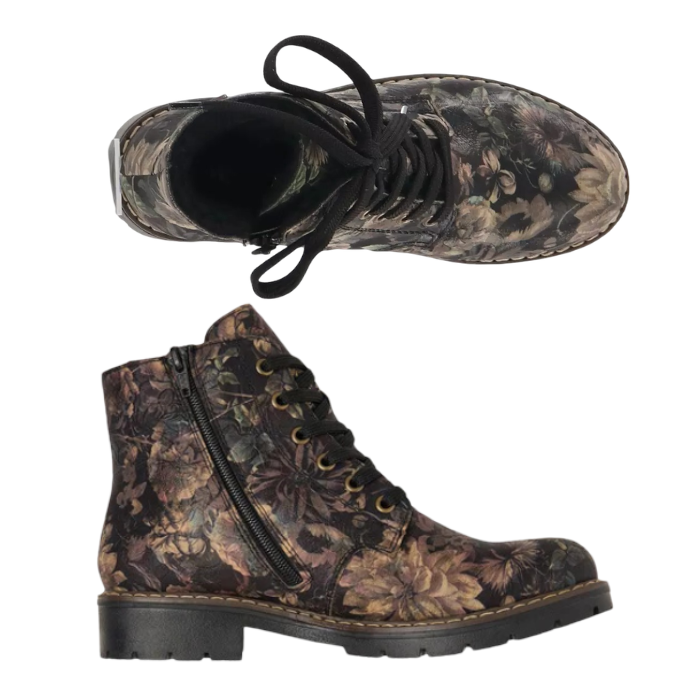 A pair of lace-up ankle boots with a dark brown and black floral camouflage pattern, black laces, and a chunky black outsole.