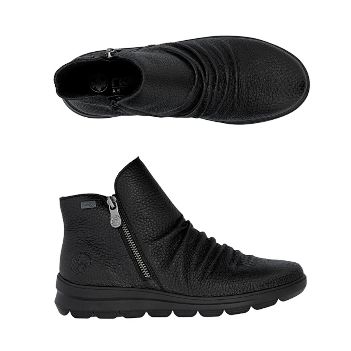 Pair of Black ankle boots with side zippers, scrunched accents on foot and thick rubber outsole.