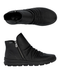 Pair of Black ankle boots with side zippers, scrunched accents on foot and thick rubber outsole.