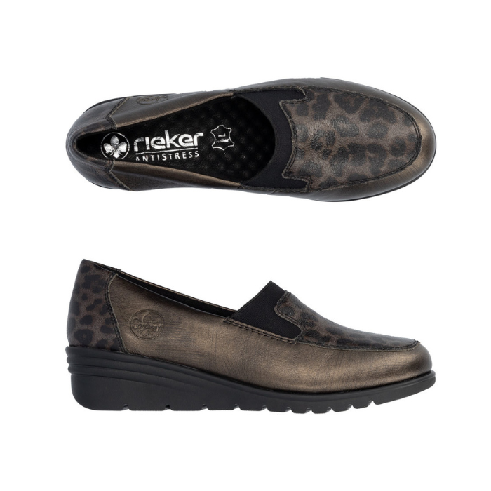Pair of Brown slip-on wedge shoes with black leopard print pattern accents and black rubber outsole.