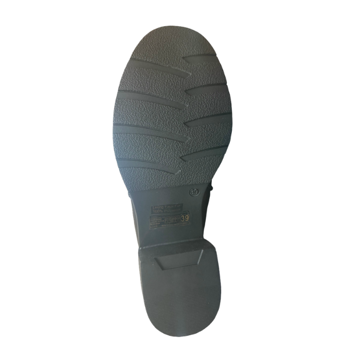 Black rubber outsole of ankle boot with block heel and light tread pattern.