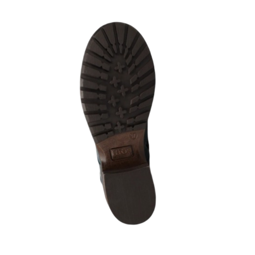 Brown treaded outsole with Taos label in middle.