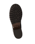 Brown treaded outsole with Taos label in middle.