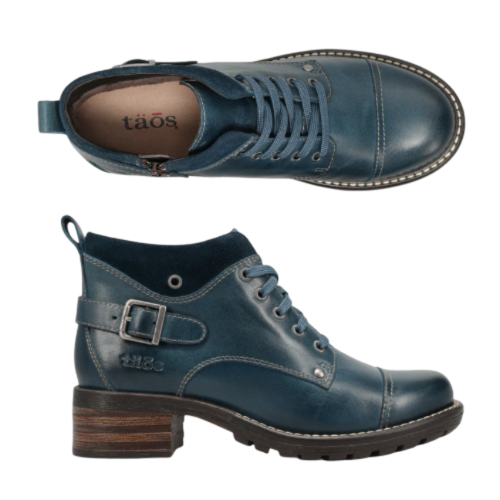 Pair of Blue leather lace-up boots with tan Taos logo&#39;d footbed, a buckle at heel and brown low block heeled outsole.