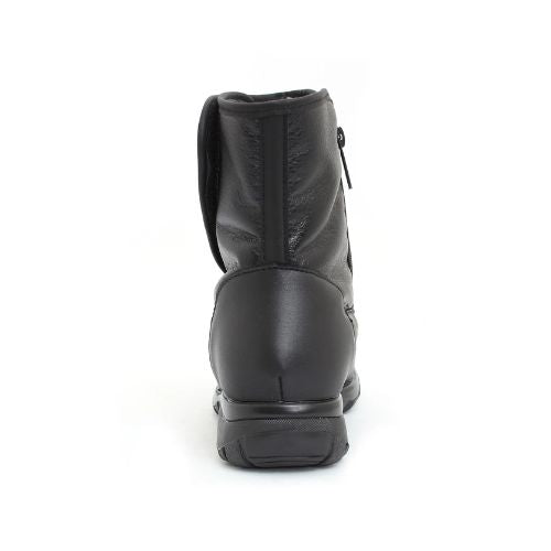 Heel of a black mid-calf black leather boot with a zipper and Velcro closure.
