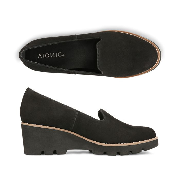 Top and side view of black wedge loafer with lugged outsole.