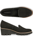 Top and side view of black wedge loafer with lugged outsole.