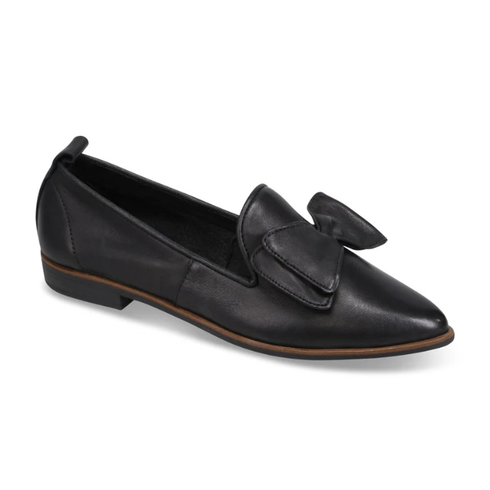 A black leather flat with a pointed toe and slight lifted heel and a decorative large bow on the vamp.