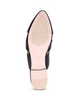 Tan sole of black mule with light treaded rubber and low heel.