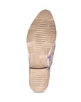 Beige outsole with light tread and low heel on a women's oxford shoe.