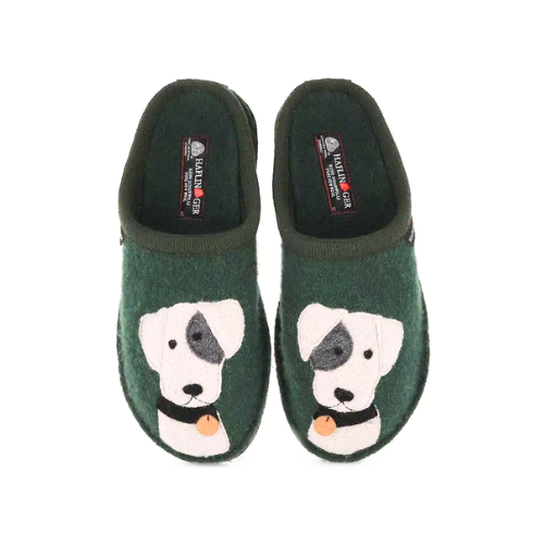 A pair of dark green boiled wool slippers with a white Jack Russell Terrier dog face design on each, a small orange dog tag detail and Haflinger logo'd footbed.