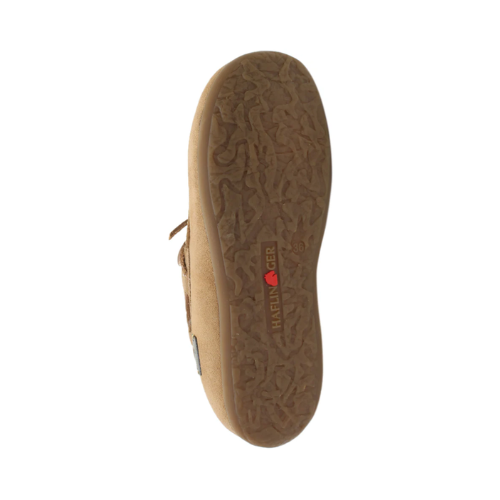 Outsole of moccasin with abstract tread pattern and Haflinger logo stamped in middle.