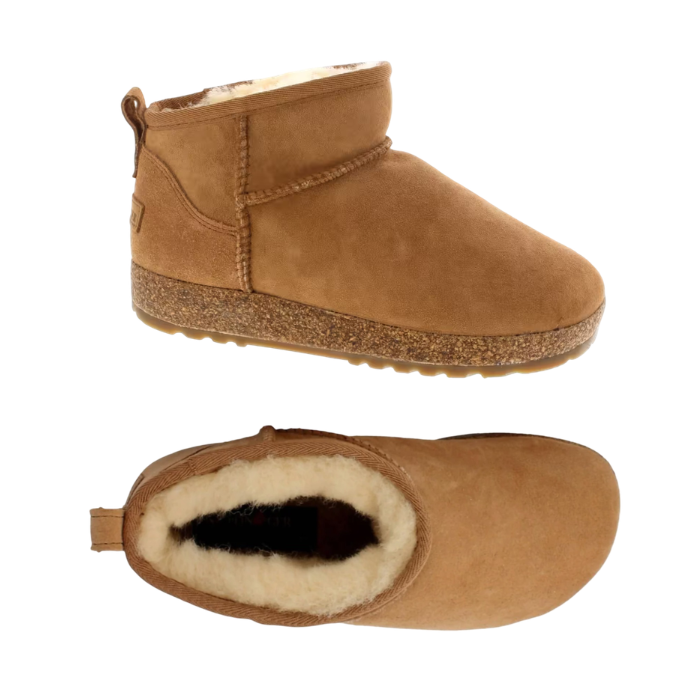 Pair of A  tan suede ankle boots with a cork midsole, cream fur lining, moccasin style accent stitching and tan outsole.