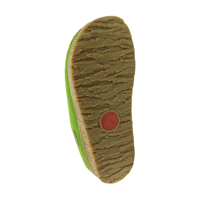 The textured brown rubber outsole of a green clog, showing a circular red Haflinger logo.