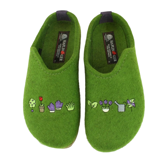 A pair of green felt clogs with embroidered gardening motifs on the toe box, Haflinger logo'd footbed and. grey heel counter.