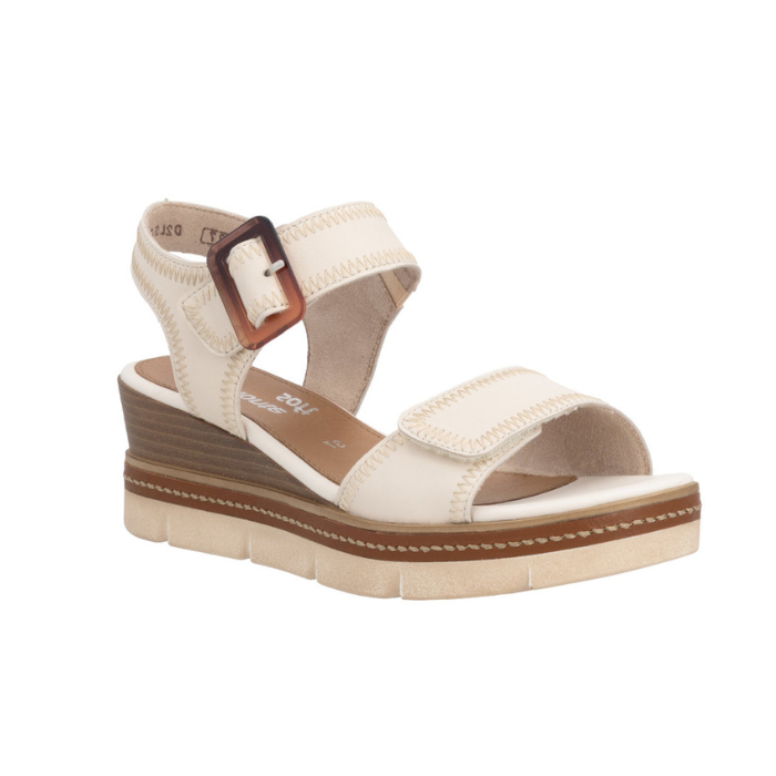 Beige wedge sandal with brown buckle, accent zig-zag stitching, tan Remonte logo'd footbed and off-white outsole.