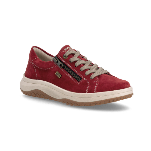 A red suede sneaker with a side zipper, beige laces, white accent stitching, cream midsole, and a brown tan outsole.
