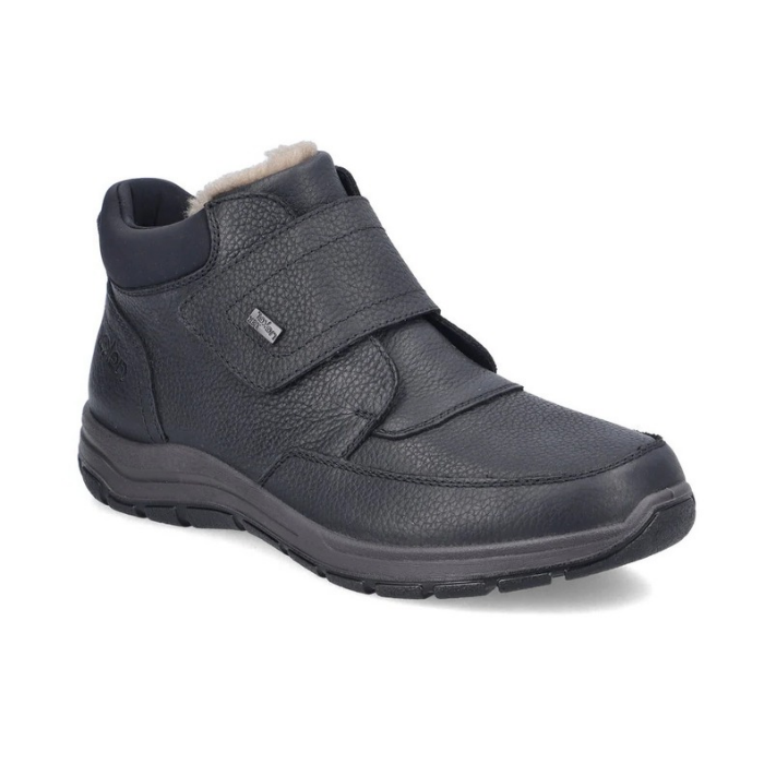 Black leather Velcro shoe with fur cuff and black treaded outsole.