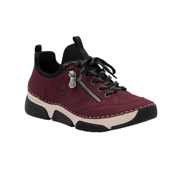 Deep red sneaker with  faux side zipper, accent stitching above the thick beige midsole and black outsole.